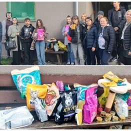 Pamiątkowe zdjęcie w „Schronisku dla Bezdomnych Zwierząt” wraz z przekazaną karmą dla zwierząt.