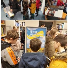 Wychowankowie przeglądają książki znajdujące się w Mediatece.