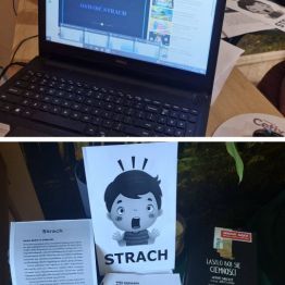 Na zdjęciu widać stolik z książkami o bajkoterapii, kartką graficzną z napisem STRACH.