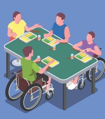 Osoby pełnosprawne z osobami niepełnosprawnymi grają przy stole.